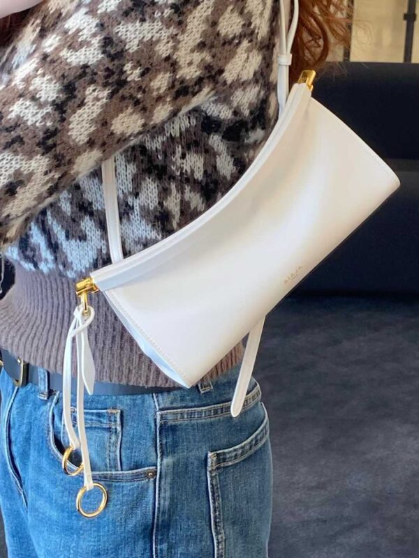 ALAIA LE CLICK EAST WEST SMALL BAG IN NUBUCK