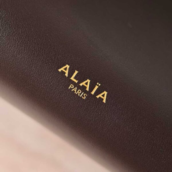 ALAIA LE CLICK EAST WEST SMALL BAG IN NUBUCK