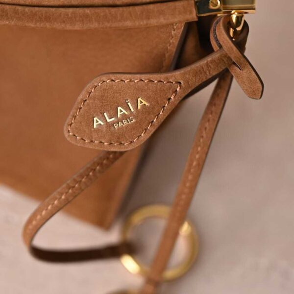 ALAIA LE CLICK EAST WEST SMALL BAG IN NUBUCK