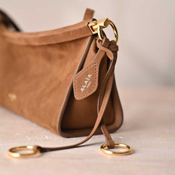 ALAIA LE CLICK EAST WEST SMALL BAG IN NUBUCK