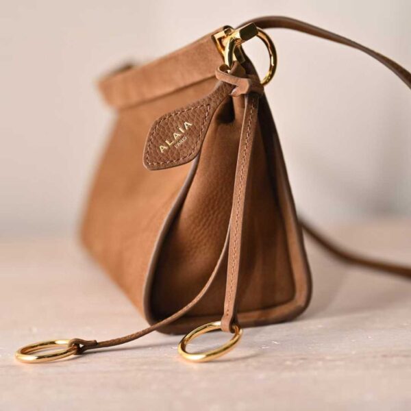 ALAIA LE CLICK EAST WEST SMALL BAG IN NUBUCK
