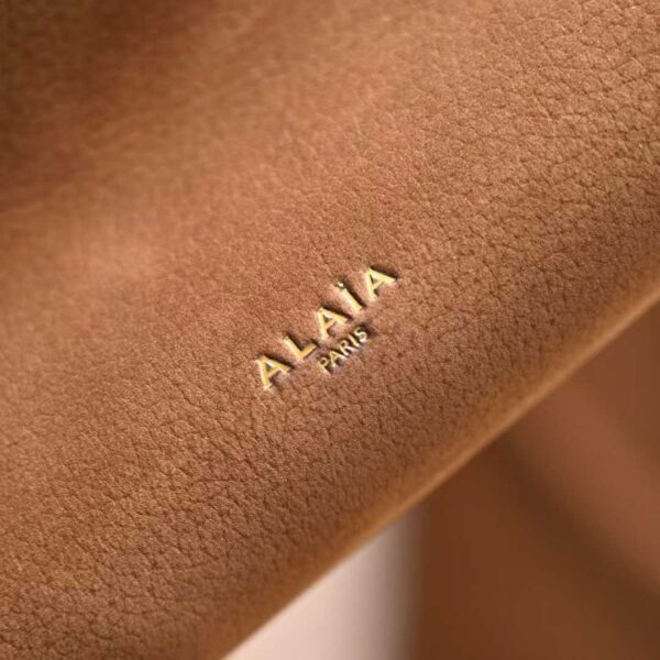 ALAIA LE CLICK EAST WEST SMALL BAG IN NUBUCK