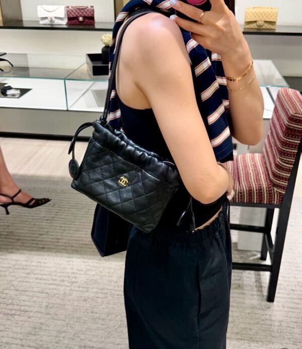 CHANEL Clutch with Leather Strap
