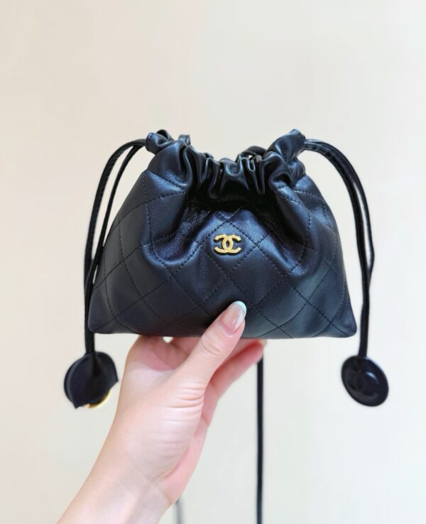 CHANEL Clutch with Leather Strap