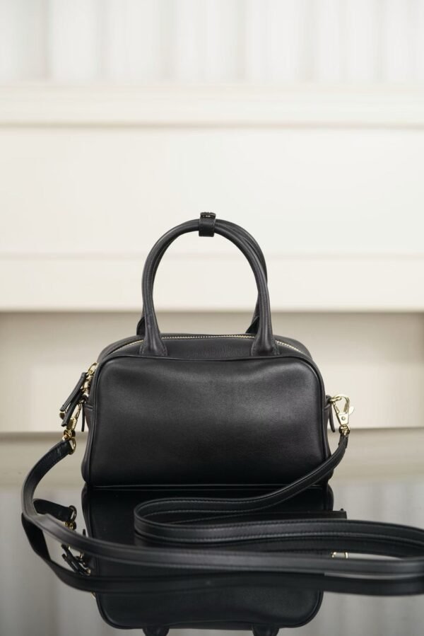 CHANEL Clutch with Leather Strap