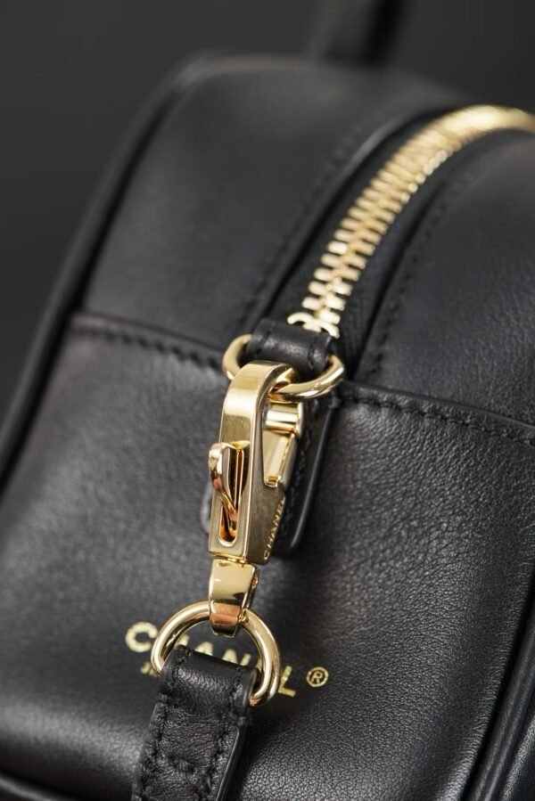 CHANEL Clutch with Leather Strap