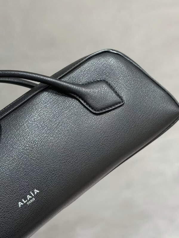 ALAIA LE TECKEL CLUTCH IN HAIRCALF