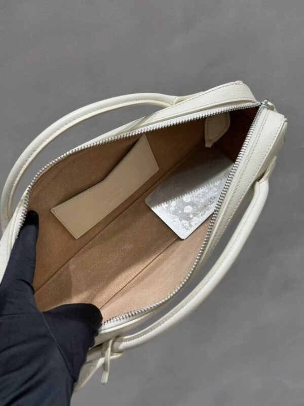 ALAIA LE TECKEL CLUTCH IN HAIRCALF