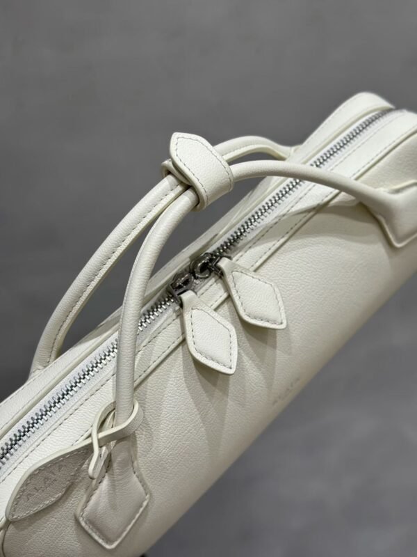 ALAIA LE TECKEL CLUTCH IN HAIRCALF