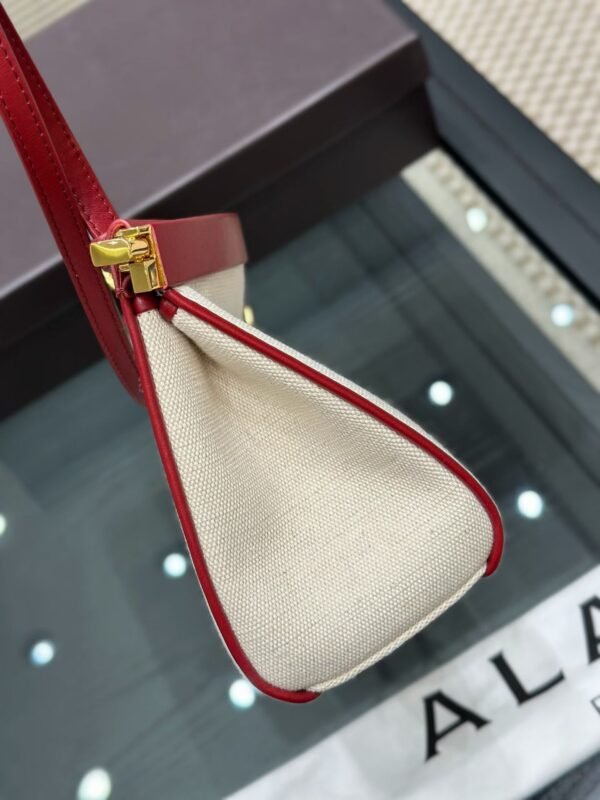 ALAIA LE CLICK EAST WEST MEDIUM BAG IN CANVAS