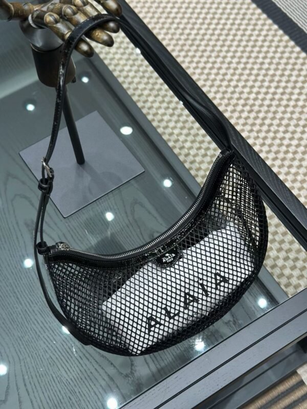 ALAIA ONE PIECE DEMI LUNE BAG IN FISHNET