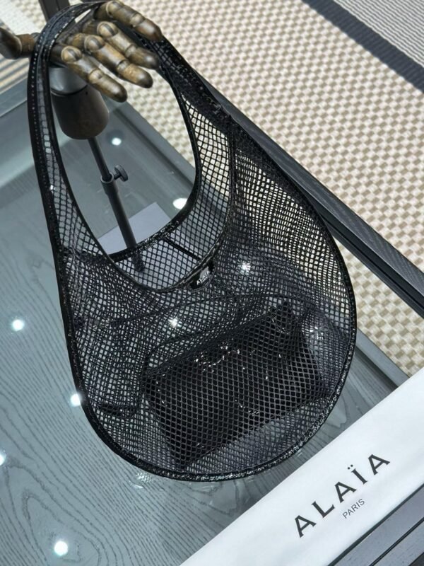 ALAIA ONE PIECE DEMI LUNE BAG IN FISHNET