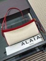 ALAIA LE CLICK EAST WEST MEDIUM BAG IN CANVAS